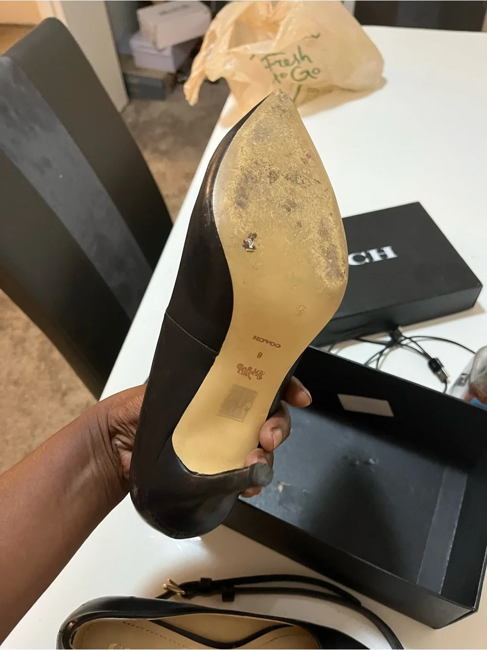 Coach Black Leather Pointed-Toe Pump with Gold Logo Accent. The purse is nwot